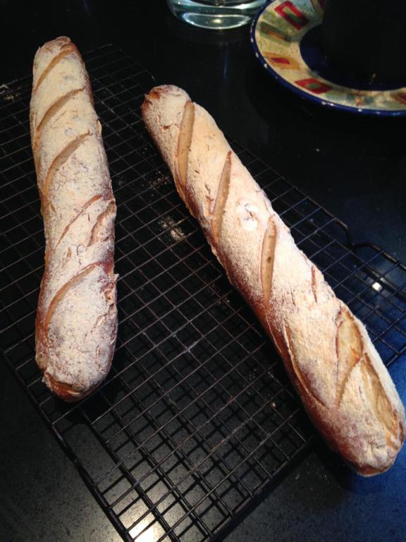 two loaves of bread sitting on a cooling rack at Salt Spring Carriage House B&B in Ganges