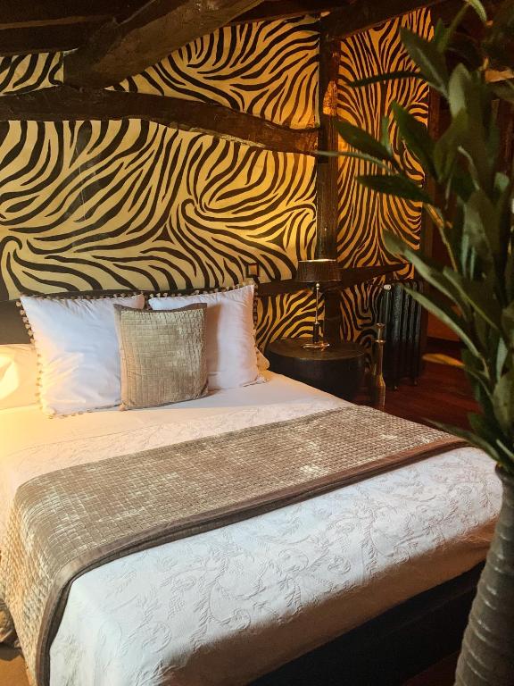 Postel nebo postele na pokoji v ubytování Hotel Boutique Valle de Oca