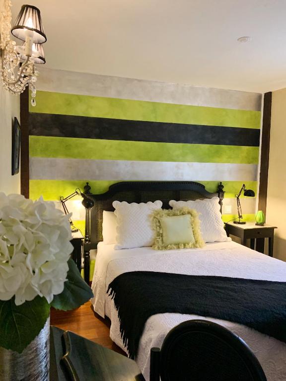 Postel nebo postele na pokoji v ubytování Hotel Boutique Valle de Oca
