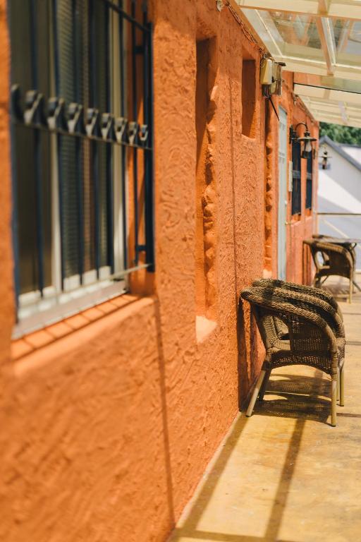 a bench sitting on the side of a building at Monet Garden Coffee Farm in Chinan