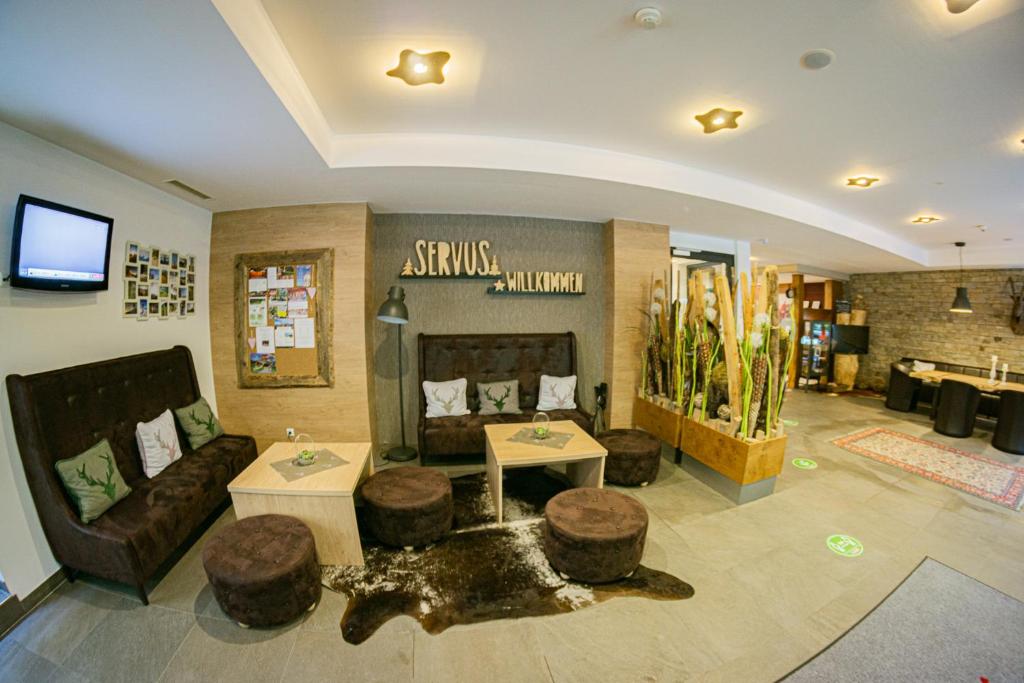 Χώρος καθιστικού στο Hotel ALPINA