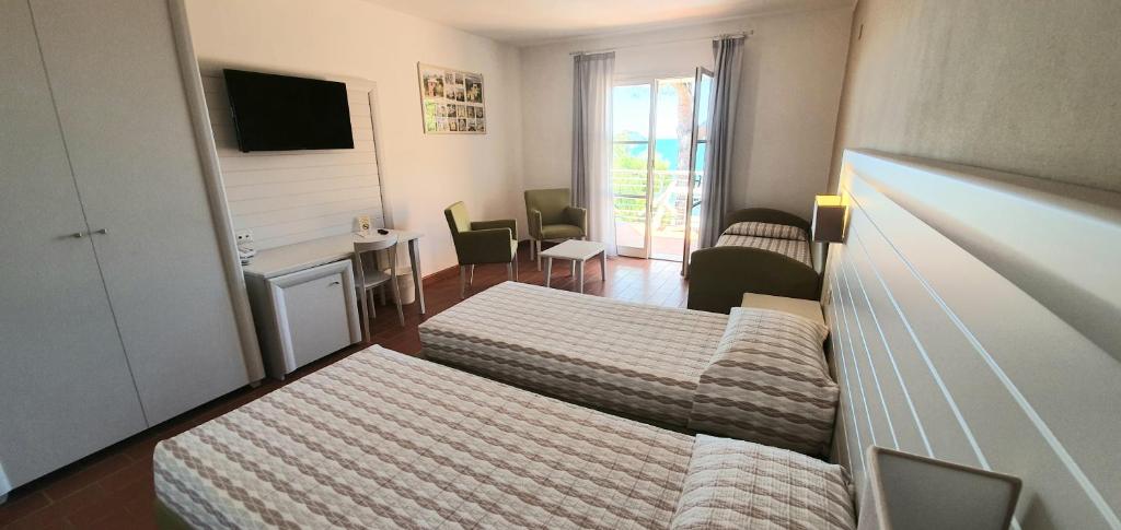 Postel nebo postele na pokoji v ubytování Hotel Mare