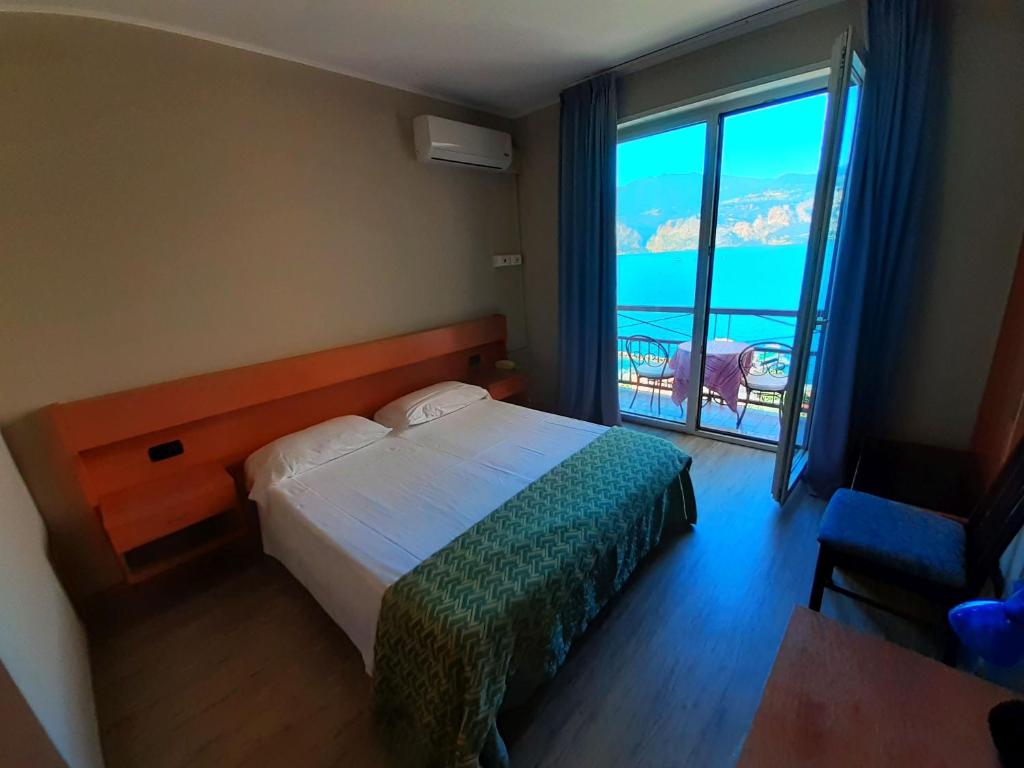 Postel nebo postele na pokoji v ubytování Hotel Antonella