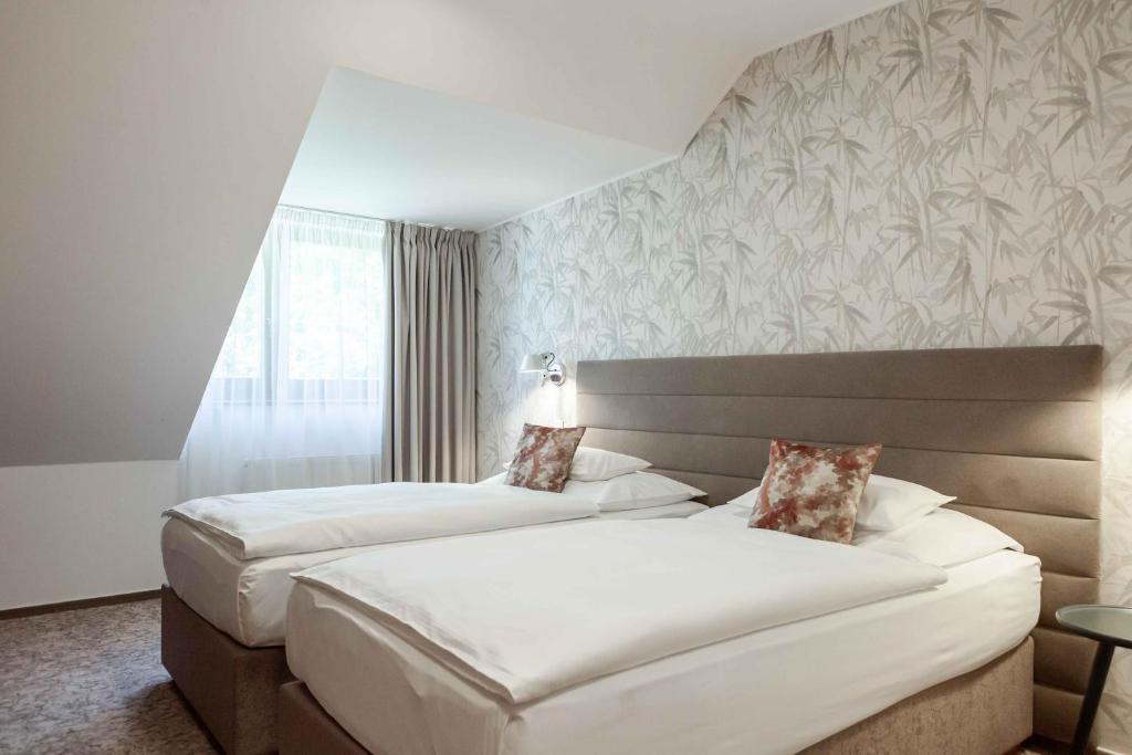 Postel nebo postele na pokoji v ubytování Equitana Hotel Resort
