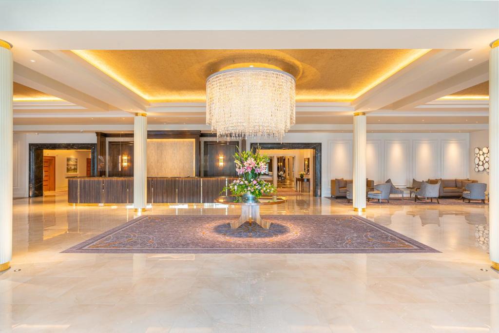 a large lobby with a large chandelier and a large lobby with a lobby at Mullingar Park Hotel in Mullingar