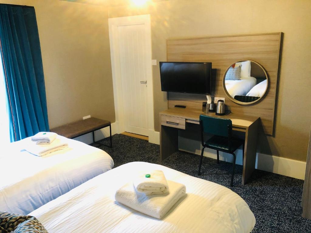 Postel nebo postele na pokoji v ubytování Sligachan Hotel