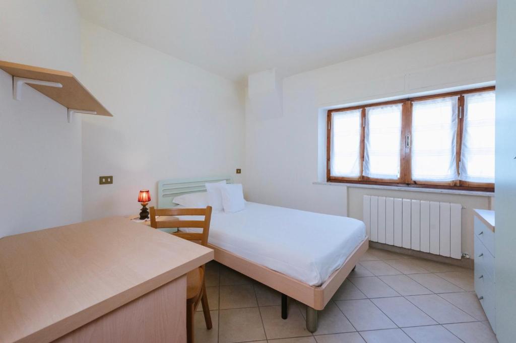 Postel nebo postele na pokoji v ubytování Casa GINESTRA a Bagno Vignoni