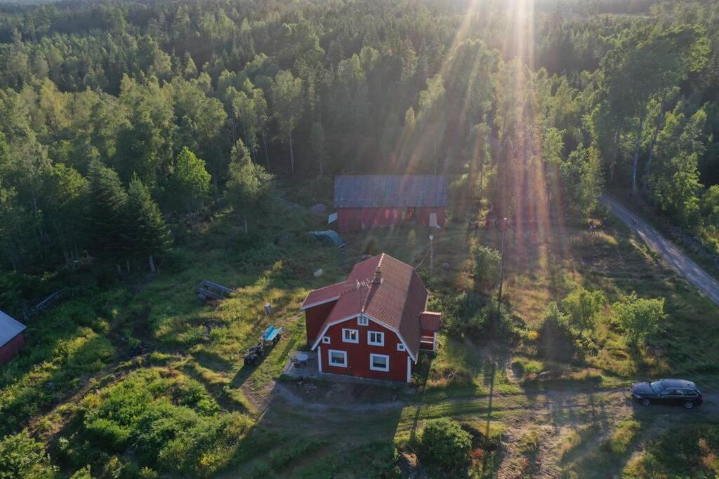 an aerial view of a house in the middle of a forest at Holiday home in Småland in Ryd
