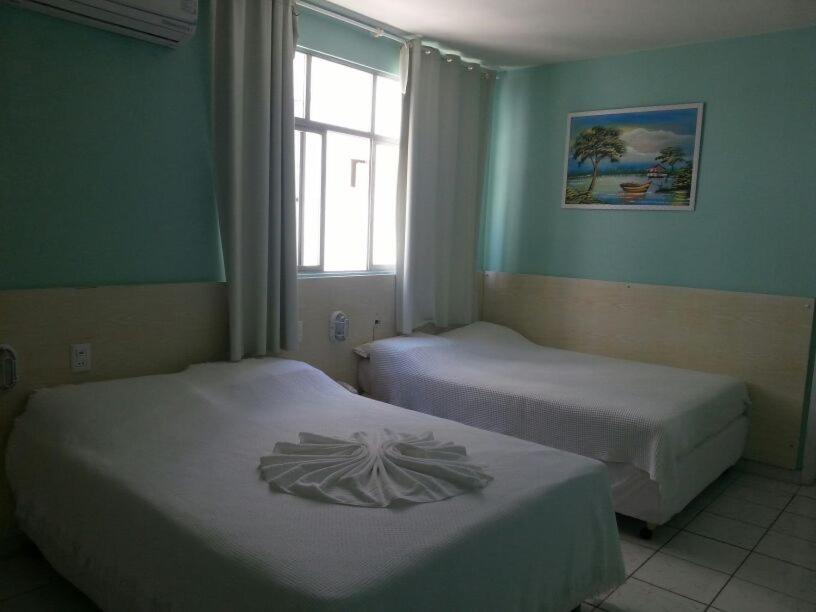Postel nebo postele na pokoji v ubytování Hotel Coqueiral