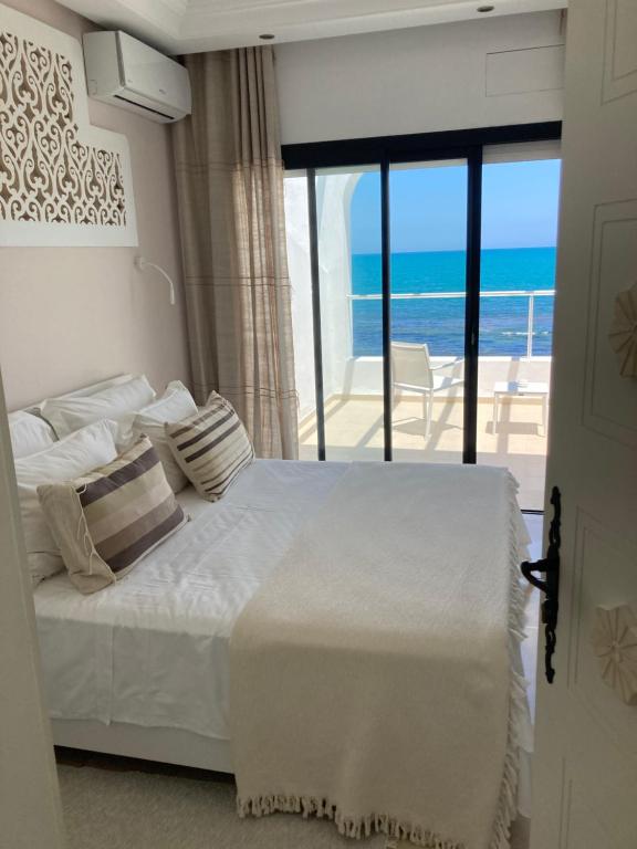 Voodi või voodid majutusasutuse Dar Corniche La Marsa (Adults Only) toas