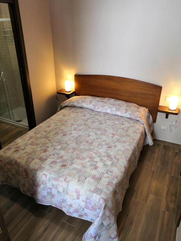Postel nebo postele na pokoji v ubytování Alla Piazza Vecchia