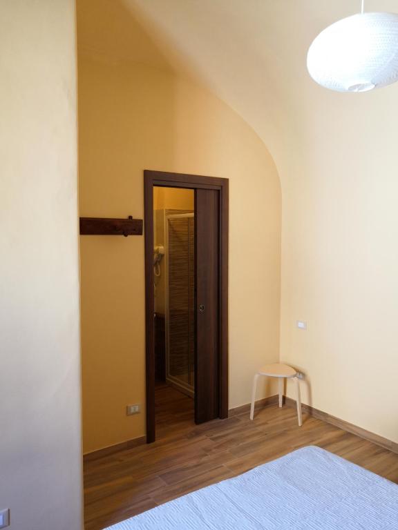 Postel nebo postele na pokoji v ubytování Alla Piazza Vecchia