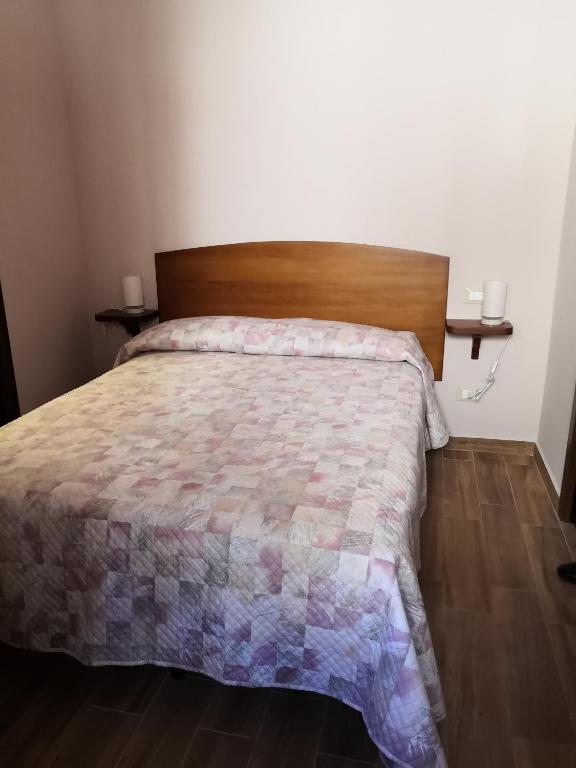 Postel nebo postele na pokoji v ubytování Alla Piazza Vecchia