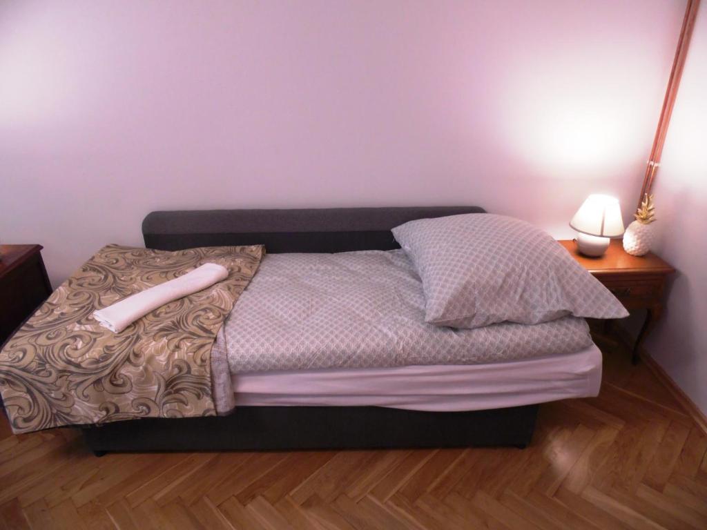 Posteľ alebo postele v izbe v ubytovaní Apartament Orchidea