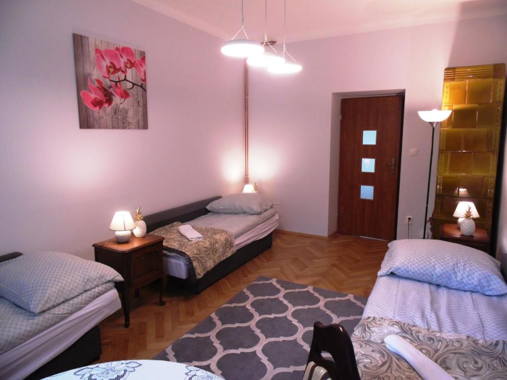 Posteľ alebo postele v izbe v ubytovaní Apartament Orchidea