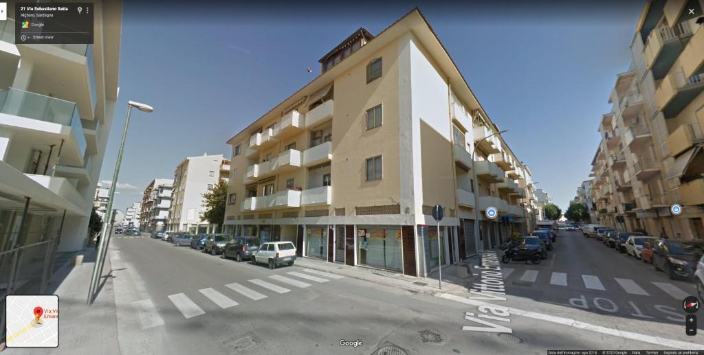 una rappresentazione di un edificio su una strada cittadina di The Shell Guest House ad Alghero