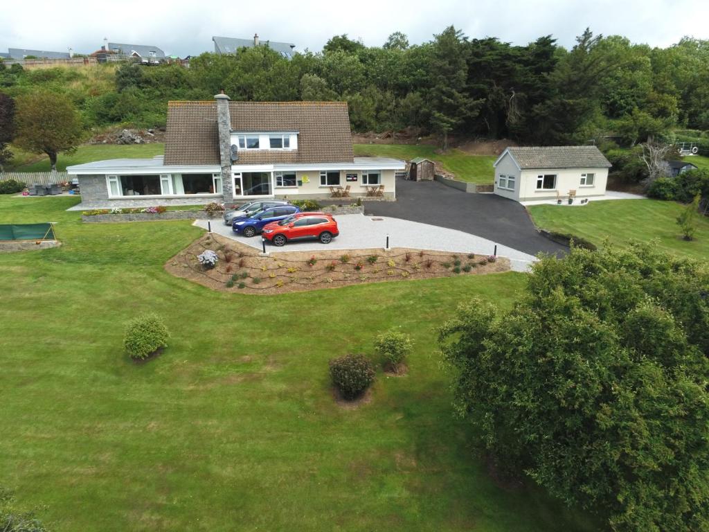 an aerial view of a house with a red car in the driveway at Summerfield Lodge B&B in Youghal