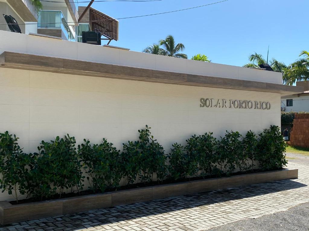 eine weiße Wand mit den Worten Sophiaapartment coop drauf in der Unterkunft Condomínio Solar Porto Rico AP 3 in Porto De Galinhas