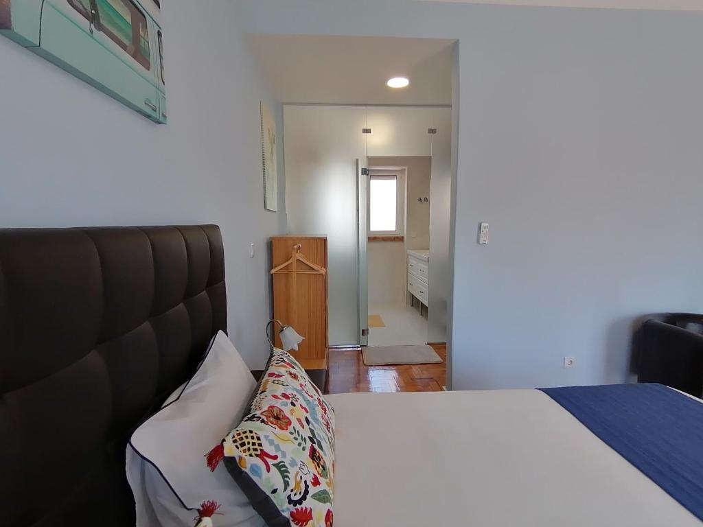 Postel nebo postele na pokoji v ubytování SK Lisboa Villa Guesthouse