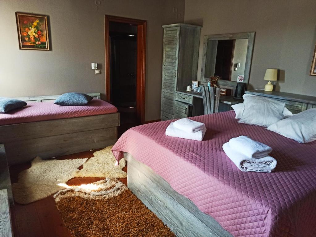 Postel nebo postele na pokoji v ubytování Foris House