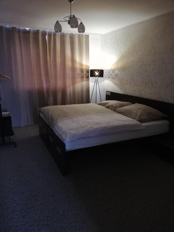 Postel nebo postele na pokoji v ubytování Apartmány Rosijo