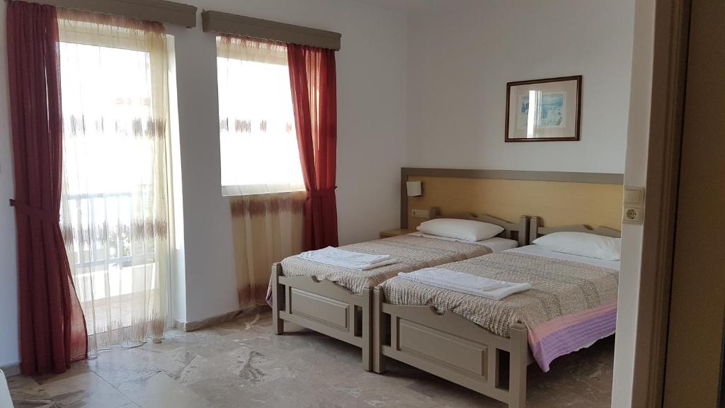 Postel nebo postele na pokoji v ubytování Luis Apartments
