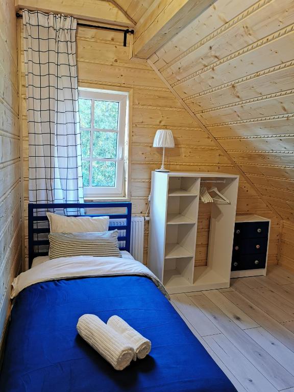 Postel nebo postele na pokoji v ubytování Górska Latarnia