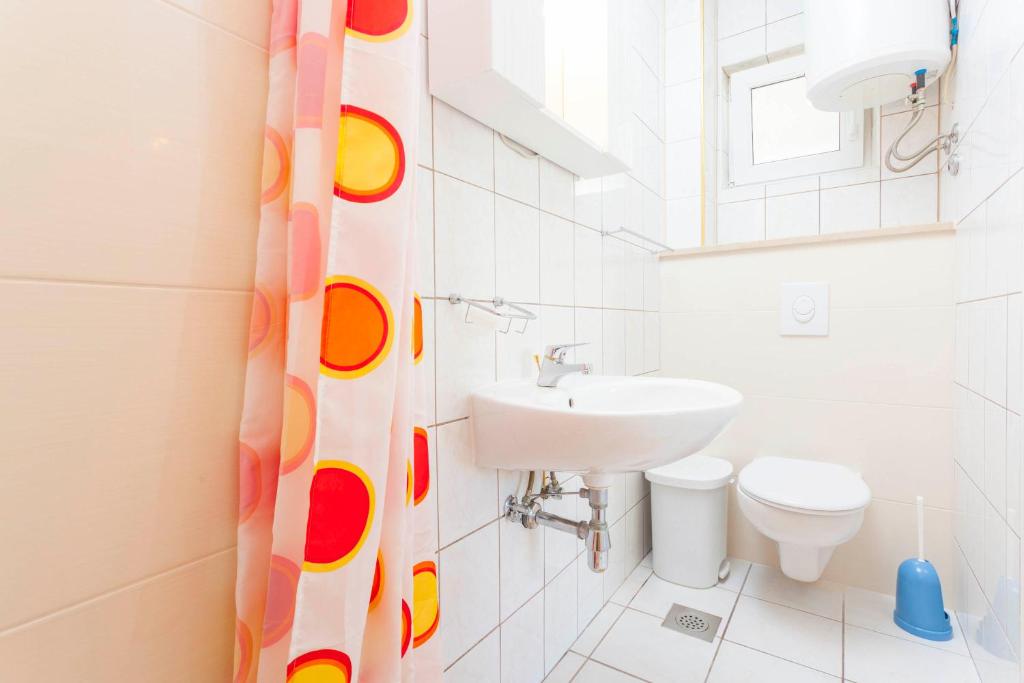 Kúpeľňa v ubytovaní APARTMANI GRBAVAC