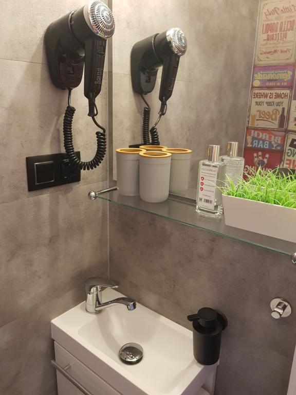 Kúpeľňa v ubytovaní Mikro Apartament Solo na Starówce 8m2
