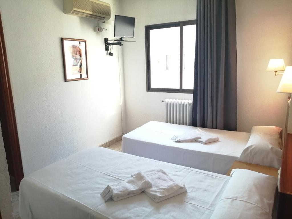 Postel nebo postele na pokoji v ubytování Hostal Jaime I