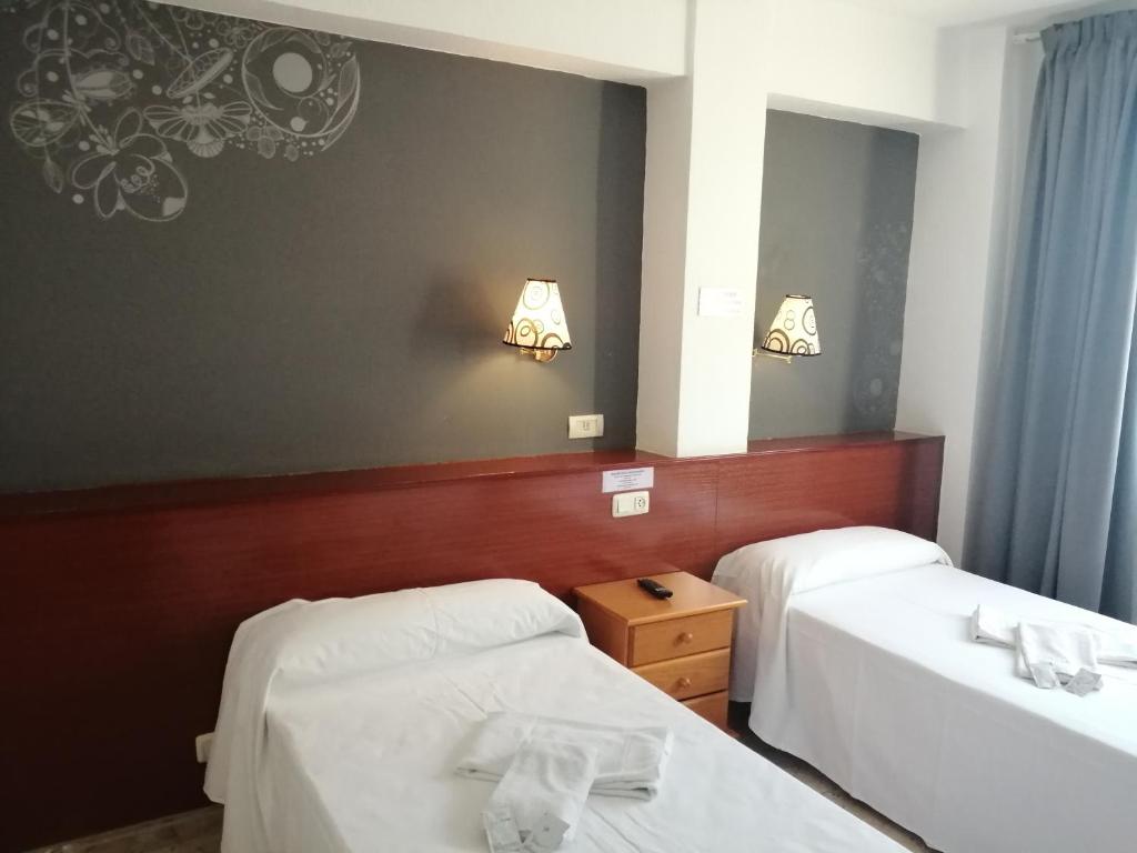 Postel nebo postele na pokoji v ubytování Hostal Jaime I
