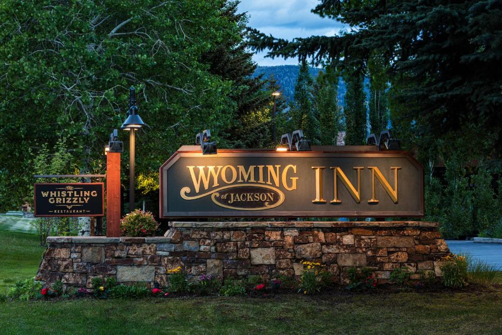 a sign for a winning inn in a park at Wyoming Inn of Jackson Hole in Jackson