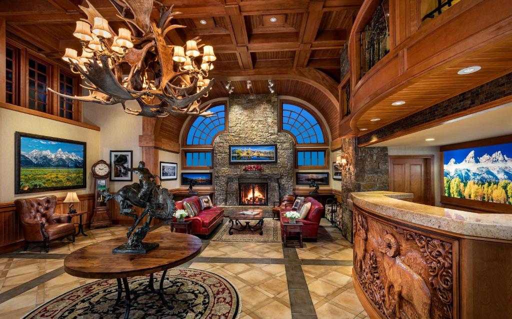 a living room filled with furniture and a large window at Wyoming Inn of Jackson Hole in Jackson