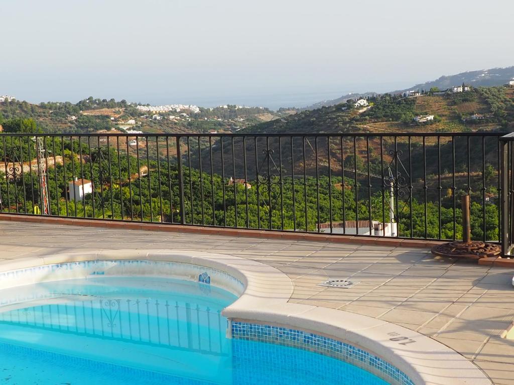 a swimming pool with a view of a mountain at Apartment Joaquin in Frigiliana