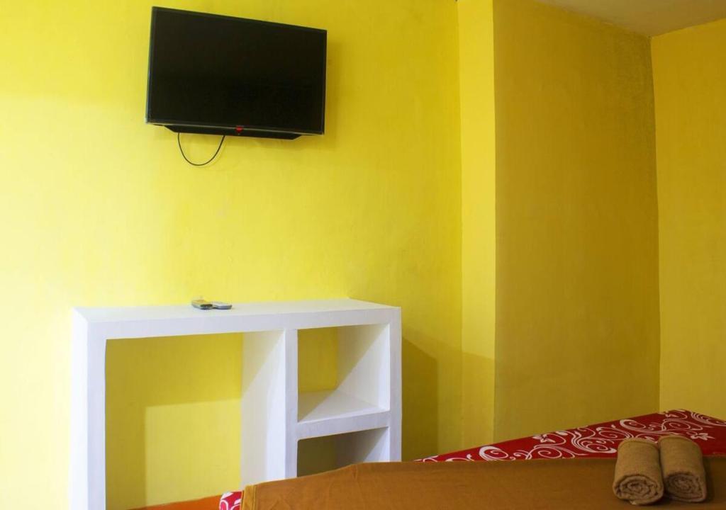 TV a/nebo společenská místnost v ubytování New Priok Indah Syariah Hotel
