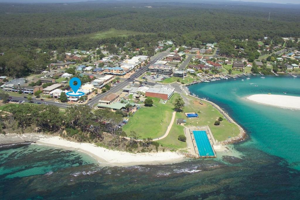 an aerial view of a beach with a resort at Secret at Huskisson in Huskisson