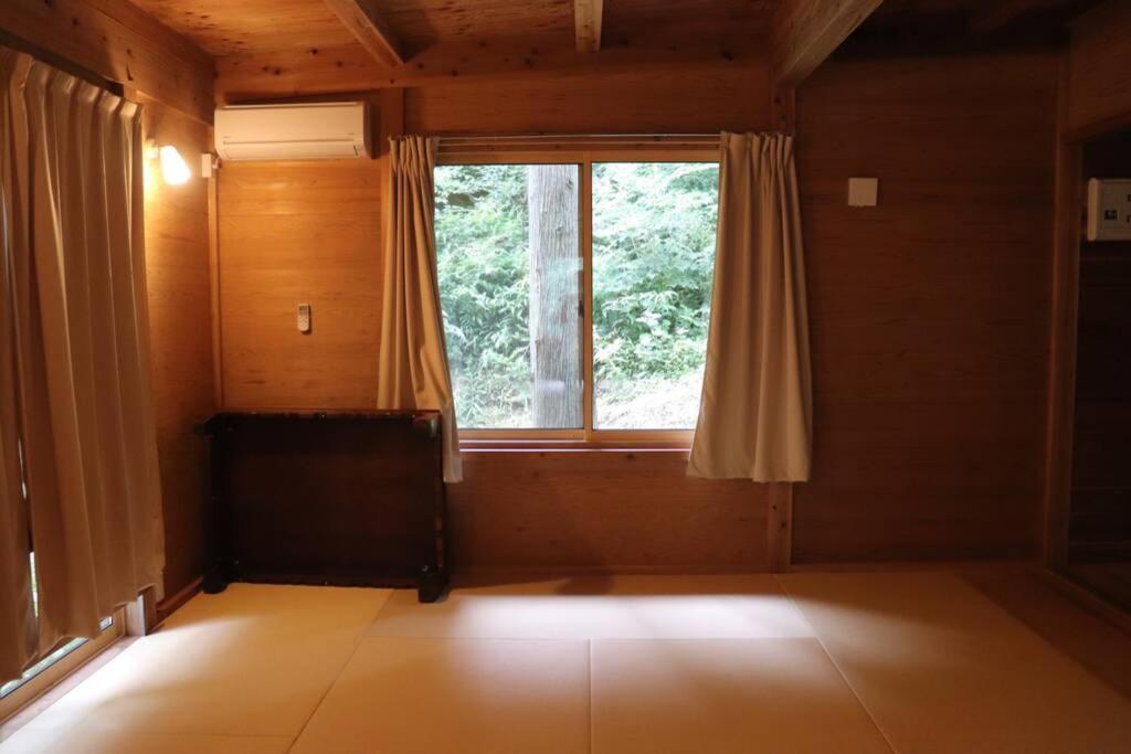 Postel nebo postele na pokoji v ubytování YAMAYA BASE 2