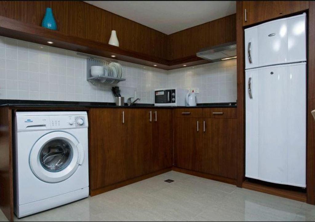 A cozinha ou cozinha compacta de Phoenix Plaza Hotel Apartments