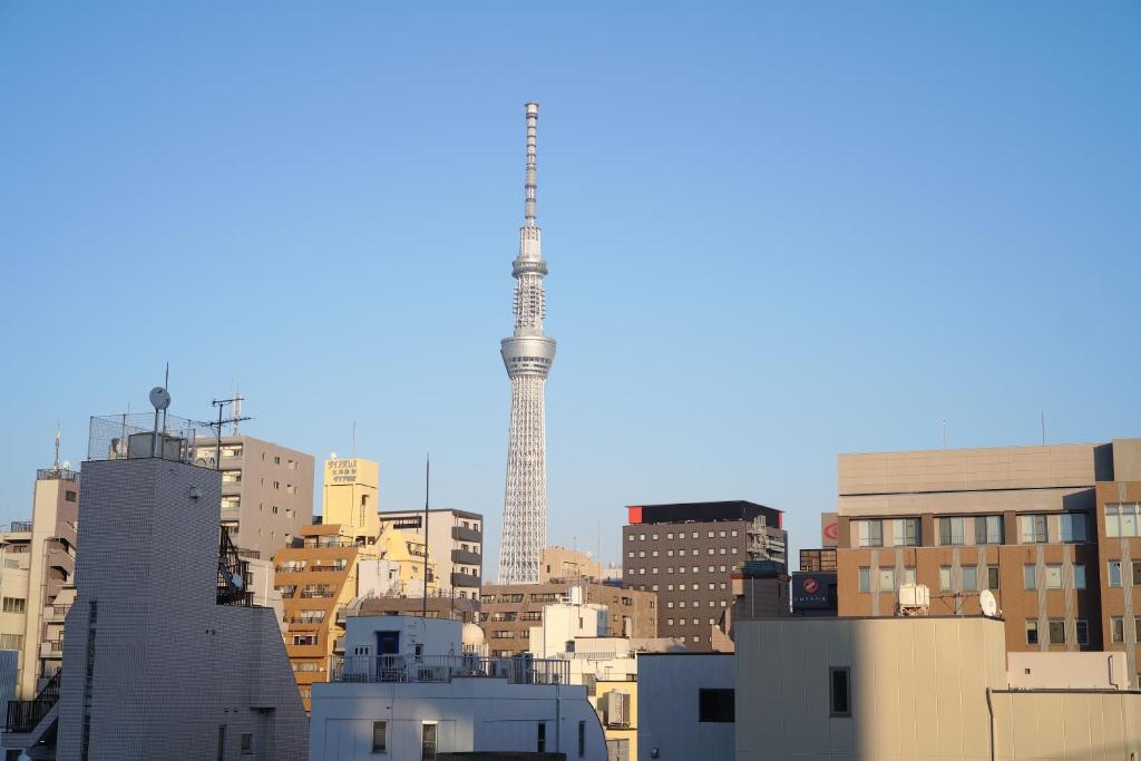 a view of a city skyline with a communication tower at TOKYO-W-INN Asakusa in Tokyo