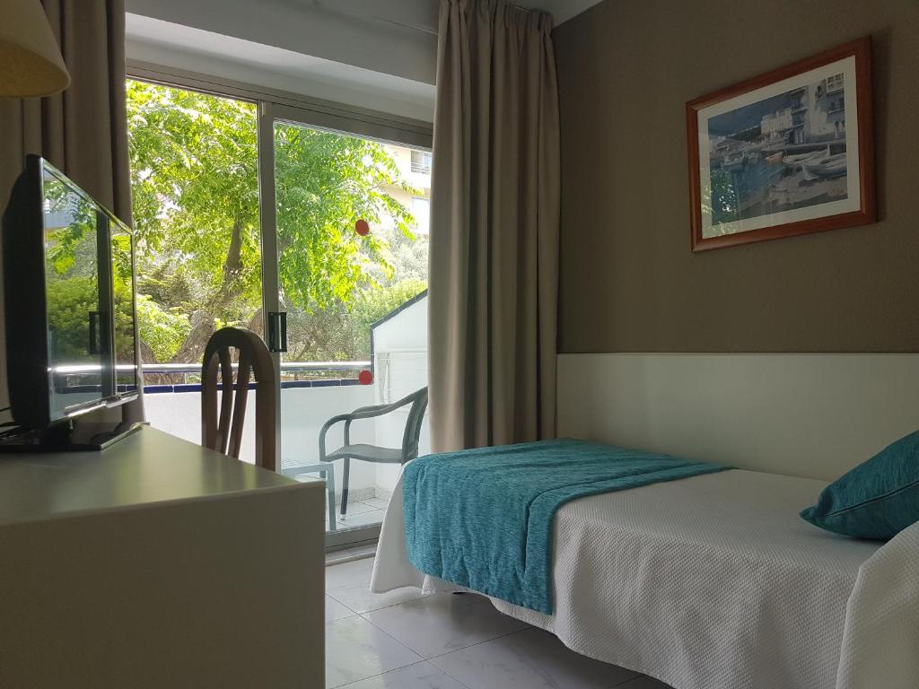 Posteľ alebo postele v izbe v ubytovaní Hotel Mariant