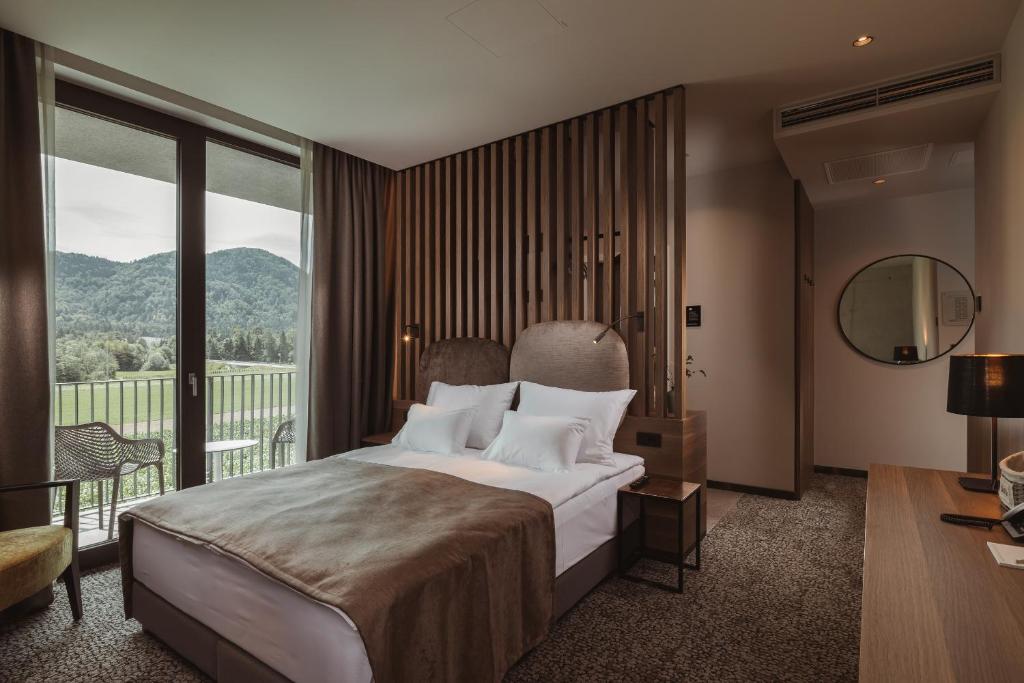 Postel nebo postele na pokoji v ubytování Hotel Grof
