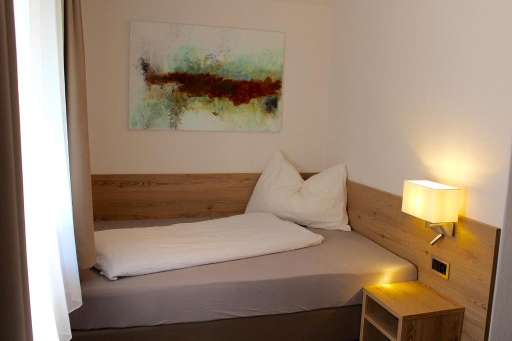 Postel nebo postele na pokoji v ubytování Haus Les Mélèzes