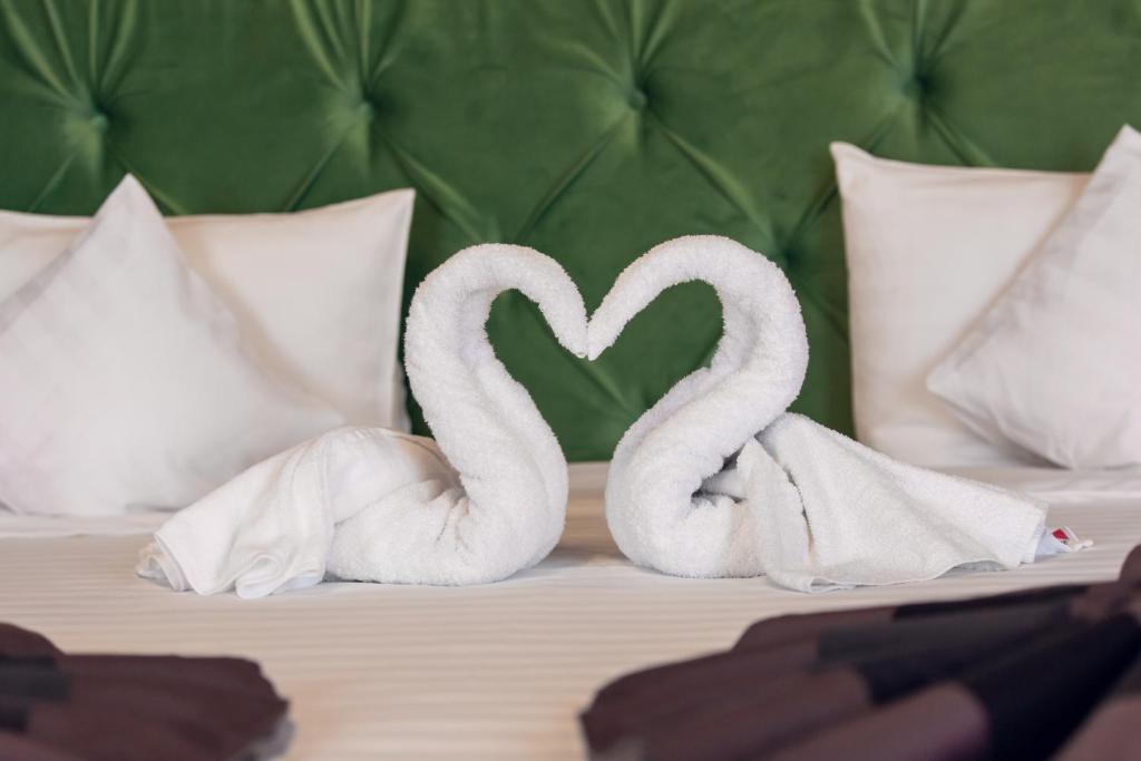 Postel nebo postele na pokoji v ubytování Hotel Am Ring