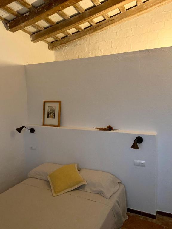 A bed or beds in a room at Ecoturisme Mas Ribas