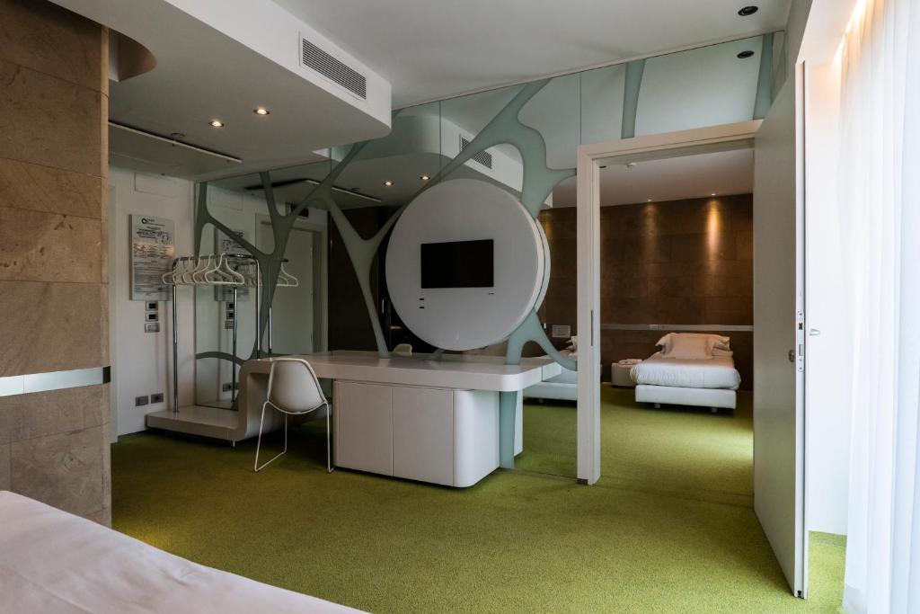 Postel nebo postele na pokoji v ubytování A Point Arezzo Park Hotel