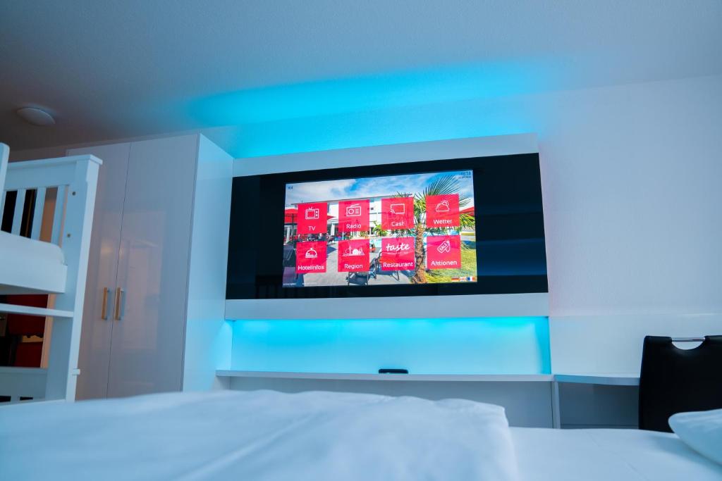 TV a/nebo společenská místnost v ubytování Hotel Andante Rust