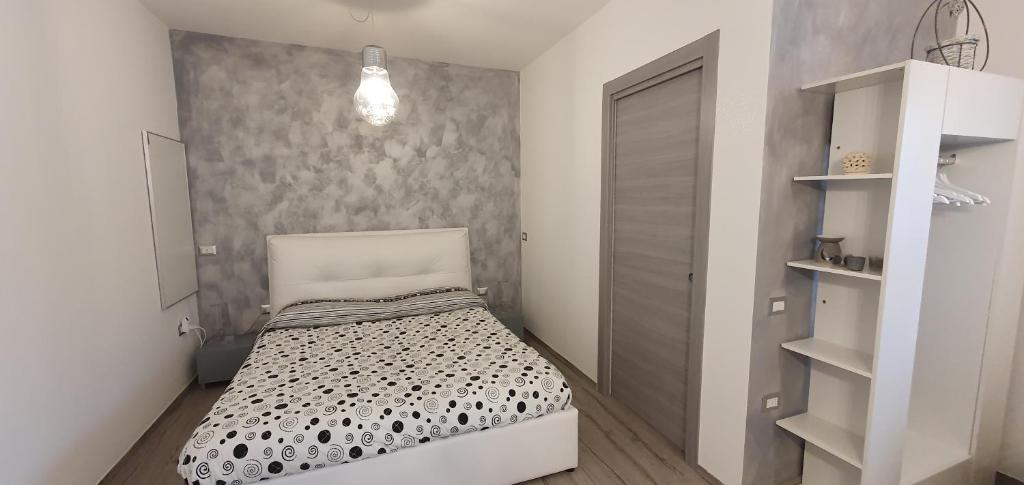 Posteľ alebo postele v izbe v ubytovaní La Casetta tra Sassi e Ulivi B&B