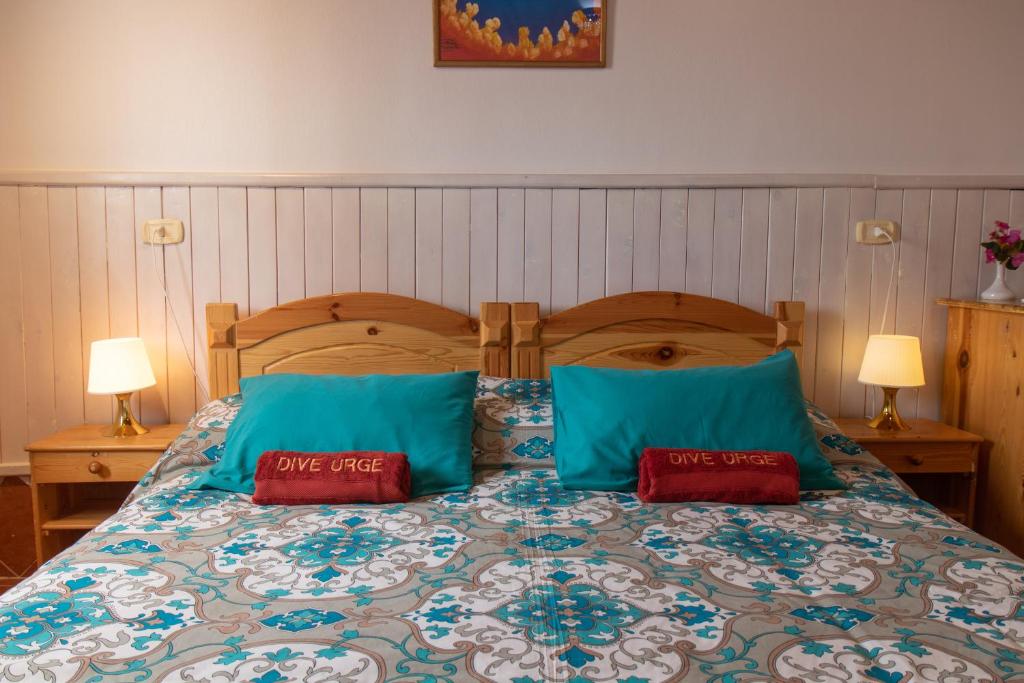 Postel nebo postele na pokoji v ubytování Dive Urge