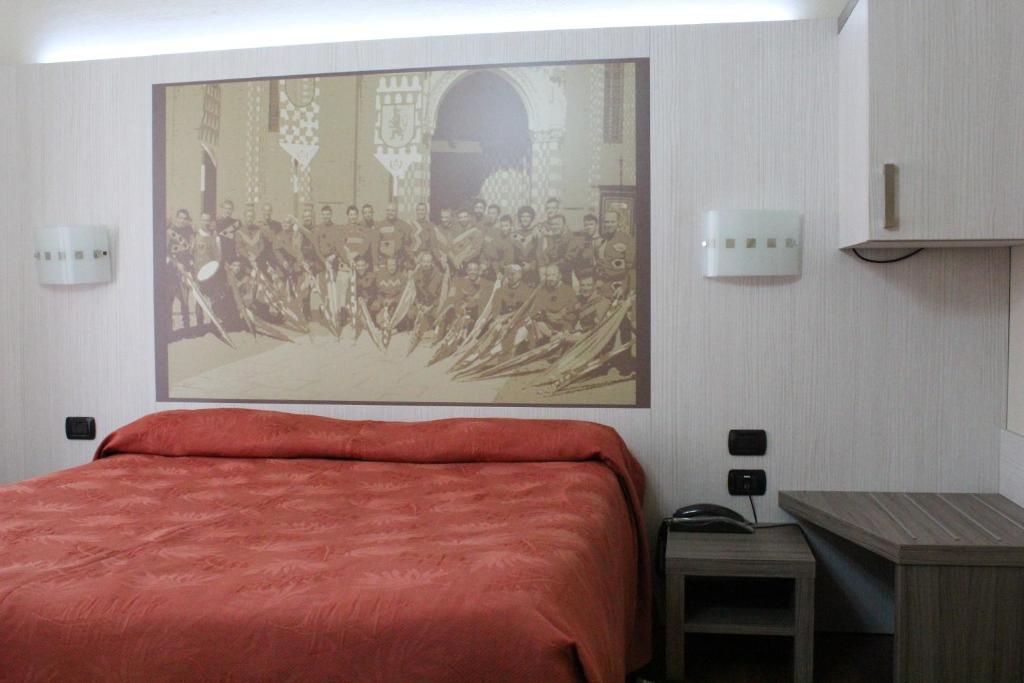 Postel nebo postele na pokoji v ubytování Hotel Rainero