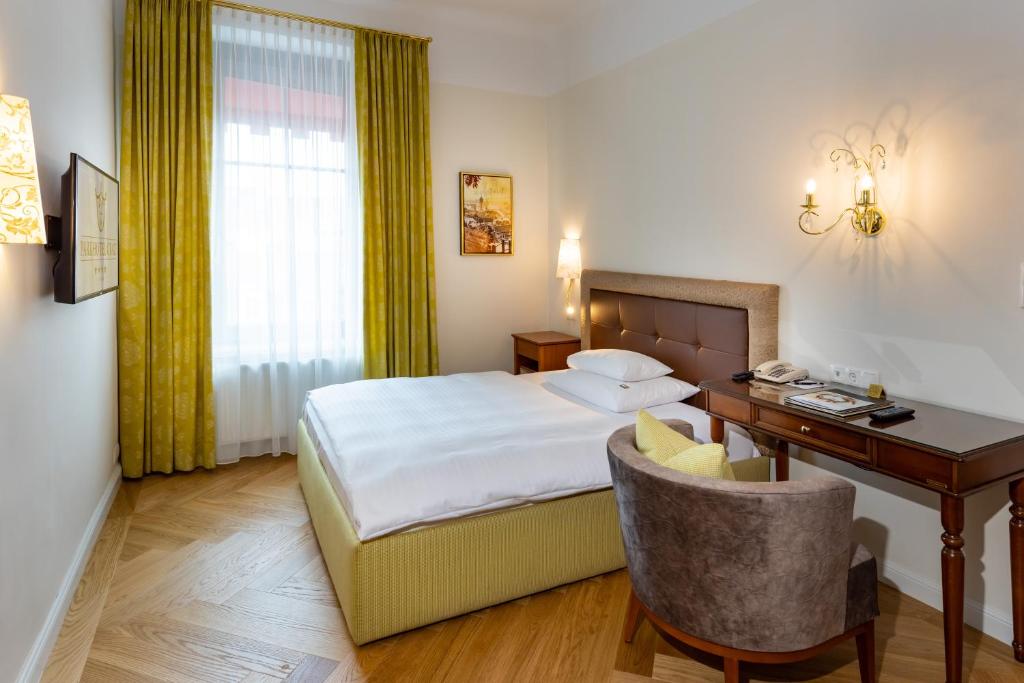 Postel nebo postele na pokoji v ubytování Parkhotel Graz - Traditional Luxury